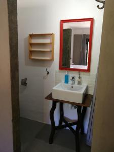 a bathroom with a sink and a mirror at Stay @ Dudok in Oudtshoorn
