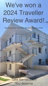 a sign that reads weve won a traveler review award at Guesthouse - Hotel California in Novalja