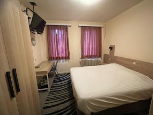 Letto o letti in una camera di Hotel Bristol Internationaal