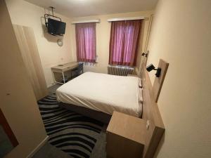 Letto o letti in una camera di Hotel Bristol Internationaal