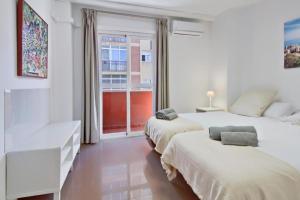 Posteľ alebo postele v izbe v ubytovaní Amplio piso con terraza