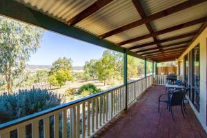 a screened porch with a view of the desert at Pecan Hill BNB in Toodyay