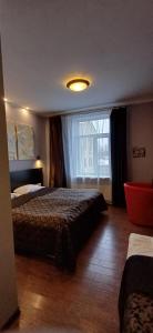 Postel nebo postele na pokoji v ubytování Primo Hotel
