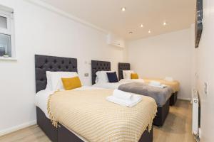 Ένα ή περισσότερα κρεβάτια σε δωμάτιο στο K Suites - Portland Road