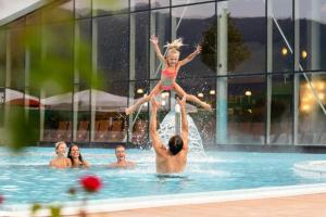 a group of people in a swimming pool at Hallerhaus in Altenmarkt im Pongau