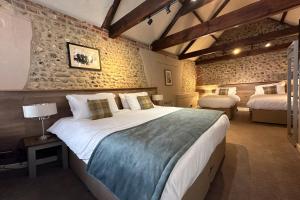 a bedroom with a large bed in a room at The Lobster in Sheringham