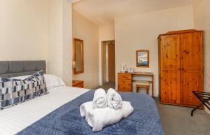 Ένα ή περισσότερα κρεβάτια σε δωμάτιο στο St Marys Guest House