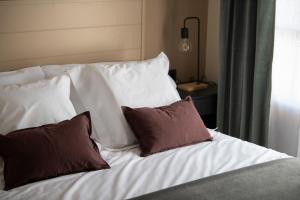 Postel nebo postele na pokoji v ubytování Hotel Siuranella