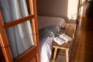 Postel nebo postele na pokoji v ubytování Hotel Siuranella