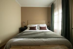 Postel nebo postele na pokoji v ubytování Hotel Siuranella