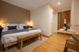 Postel nebo postele na pokoji v ubytování Hotel Siuranella