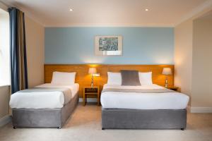 Voodi või voodid majutusasutuse Hotel Ceann Sibeal toas