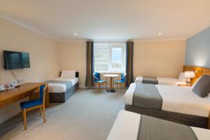 Voodi või voodid majutusasutuse Hotel Ceann Sibeal toas