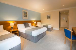 Hotel Ceann Sibeal tesisinde bir odada yatak veya yataklar