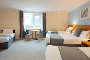 Voodi või voodid majutusasutuse Hotel Ceann Sibeal toas