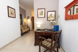 a living room with a desk and a chair at Prime Located Home by *The Sea* in Sliema