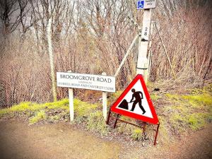 a road sign and a snowdrop road sign at Modernised cottage Sleeps Six in Ore