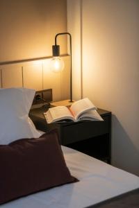 Postel nebo postele na pokoji v ubytování Hotel Siuranella