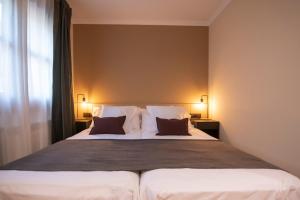 Postel nebo postele na pokoji v ubytování Hotel Siuranella