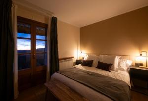 Postel nebo postele na pokoji v ubytování Hotel Siuranella