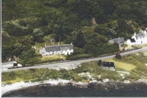 an aerial view of a house and a road at Seaview Cottage in Isle of Jura