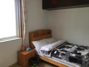 Letto o letti in una camera di Yailon House - TieXinQiao Metro St-ation - NanJing South Railway St-ation - 雅伦之屋-铁心桥地铁站-火车南站店