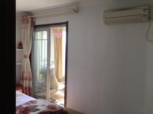 Letto o letti in una camera di Yailon House - TieXinQiao Metro St-ation - NanJing South Railway St-ation - 雅伦之屋-铁心桥地铁站-火车南站店