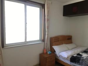 Letto o letti in una camera di Yailon House - TieXinQiao Metro St-ation - NanJing South Railway St-ation - 雅伦之屋-铁心桥地铁站-火车南站店