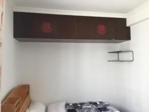 Letto o letti in una camera di Yailon House - TieXinQiao Metro St-ation - NanJing South Railway St-ation - 雅伦之屋-铁心桥地铁站-火车南站店