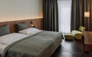 Postel nebo postele na pokoji v ubytování HEINhotel vienna airport