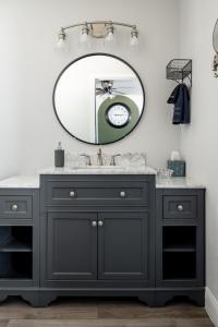 a bathroom with a black vanity and a mirror at Step Free Entrance-Wolfe Cottage at Wrenwood Ranch, King Bed in Johnson City