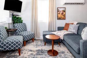 a living room with a couch and two chairs at Step Free Entrance-Wolfe Cottage at Wrenwood Ranch, King Bed in Johnson City