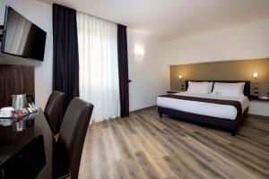 Postel nebo postele na pokoji v ubytování Best Western Hotel Biri