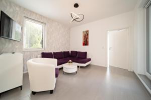 TV a/nebo společenská místnost v ubytování Appartement 2 - Dünenblick