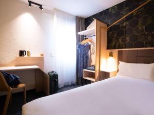 Postel nebo postele na pokoji v ubytování ibis Styles Strasbourg Nord Palais des Congrès
