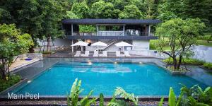 een groot zwembad voor een huis bij Luxurious Botanica Khao Yai in Khao Yai