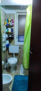 a bathroom with a toilet and a sink at Oasi Marina in Catania