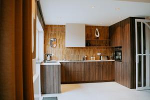 a kitchen with wood paneling and a counter top at Casa Alta in Namur