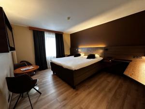 Postel nebo postele na pokoji v ubytování Hotel Melba