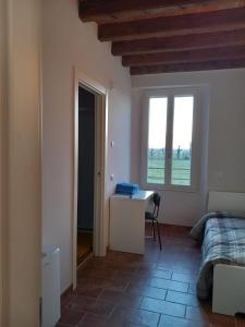 Postel nebo postele na pokoji v ubytování L'Antico Fienile Agriturismo