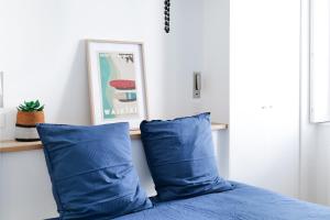 Postel nebo postele na pokoji v ubytování Superbe maison de ville à deux pas de la plage des Sables 8 personnes