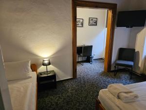 Postel nebo postele na pokoji v ubytování Hotel Bílá Paní