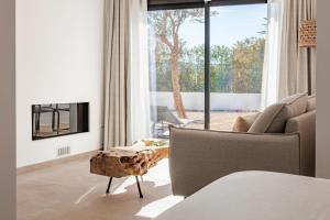a living room with a couch and a table at Hotel Boutique Mi Almazara in Jávea