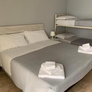Postel nebo postele na pokoji v ubytování Hotel Helvetia