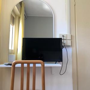 TV a/nebo společenská místnost v ubytování Hotel Helvetia + 16 fotografií