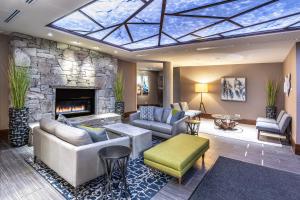 a living room with a couch and a fireplace at Evolution Whistler in Whistler