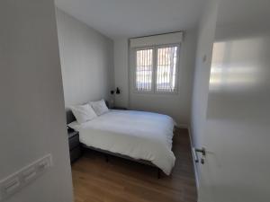 Ένα ή περισσότερα κρεβάτια σε δωμάτιο στο Apartamentos Ezkaba by Clabao +41 φωτογραφίες