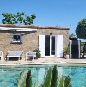 a villa with a swimming pool and a house at La Villa de la Marana in Borgo