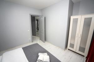 Postel nebo postele na pokoji v ubytování Arkem Maltepe