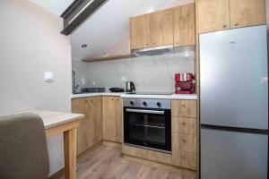 Kuchyň nebo kuchyňský kout v ubytování Sampa Attic + 11 fotografií